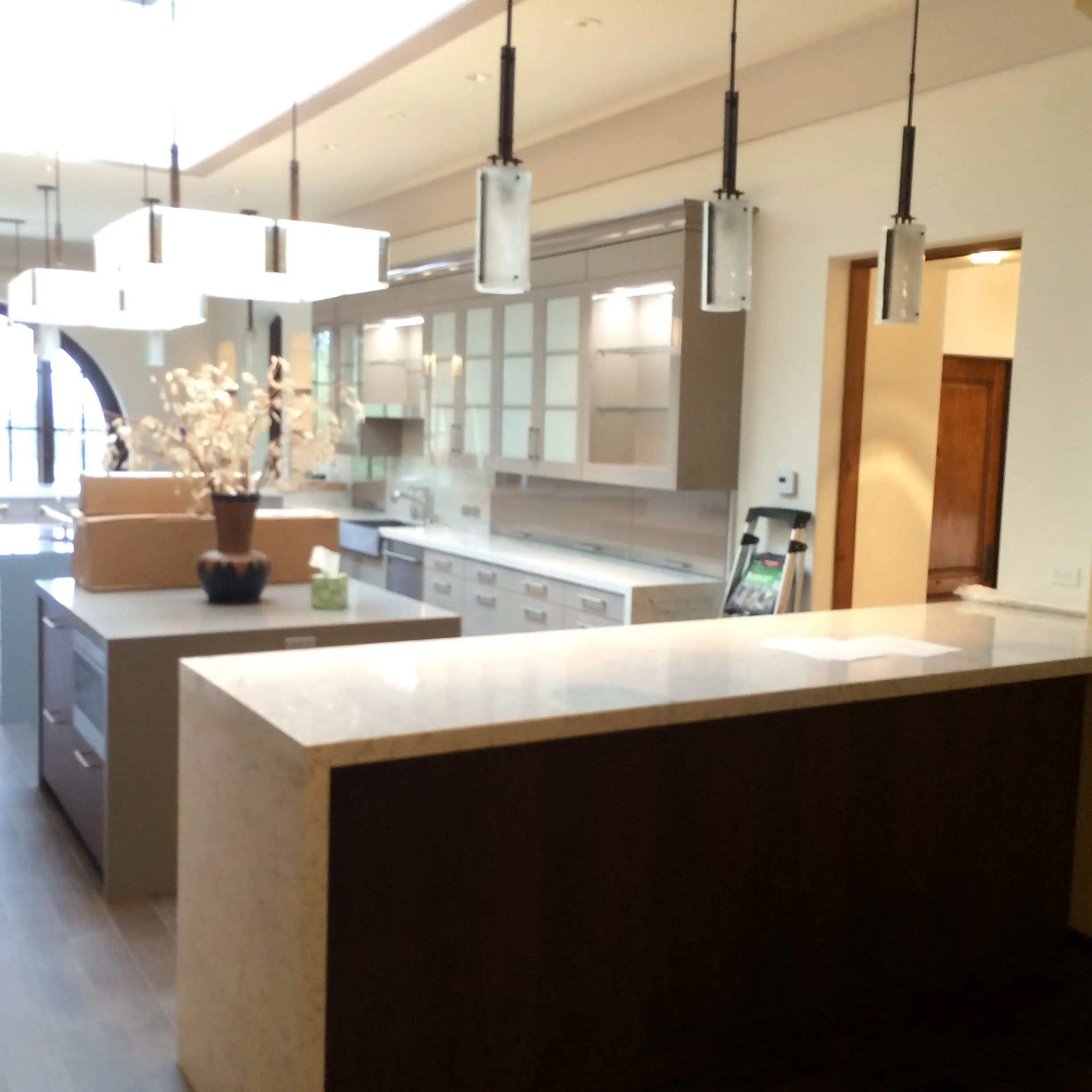 Walnut island with pendant lighting
