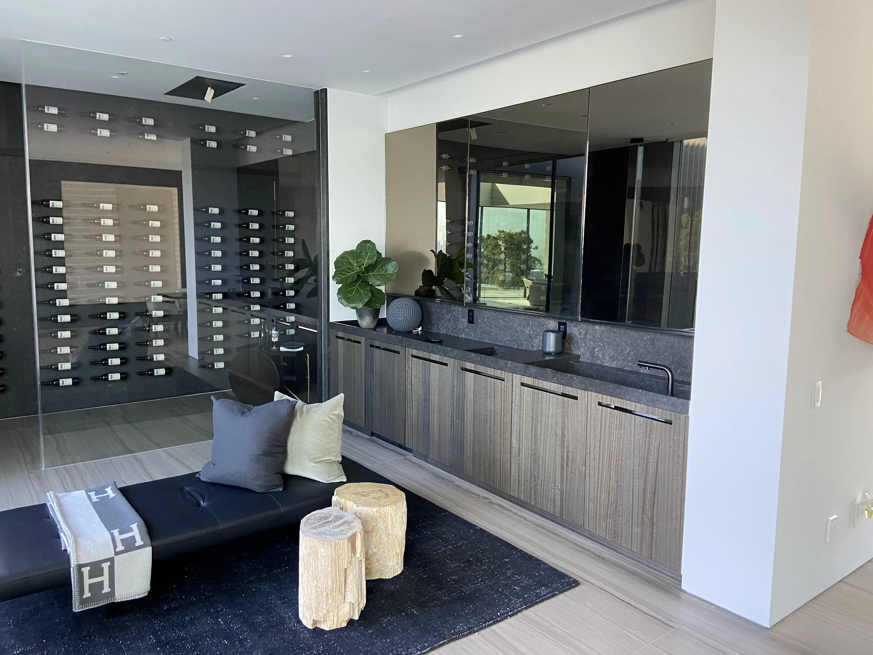 Glass wine display and oak cabinetry